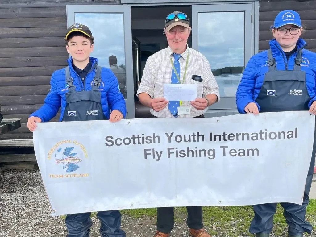 cheque presented - charity fundraising - scottish international youth fishing team